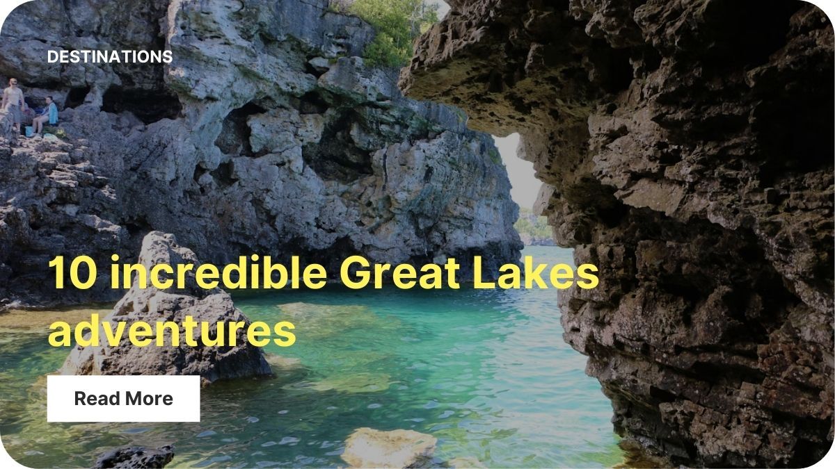 Two tall rock cliffs rise from light teal water.
