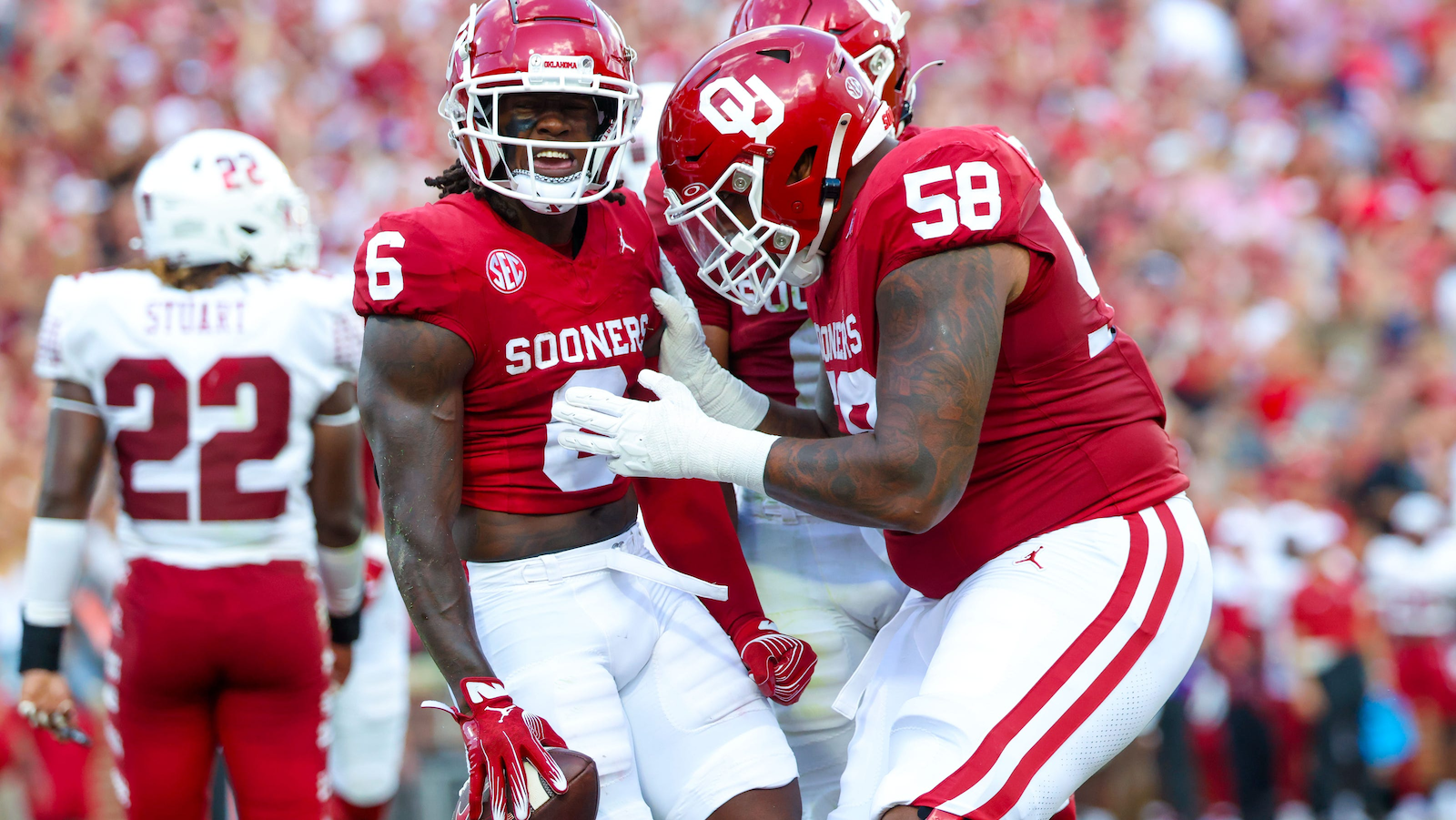 Sling TV logo on a blurred football field background