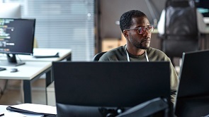 Ops manager watching over his IT estate from his chair