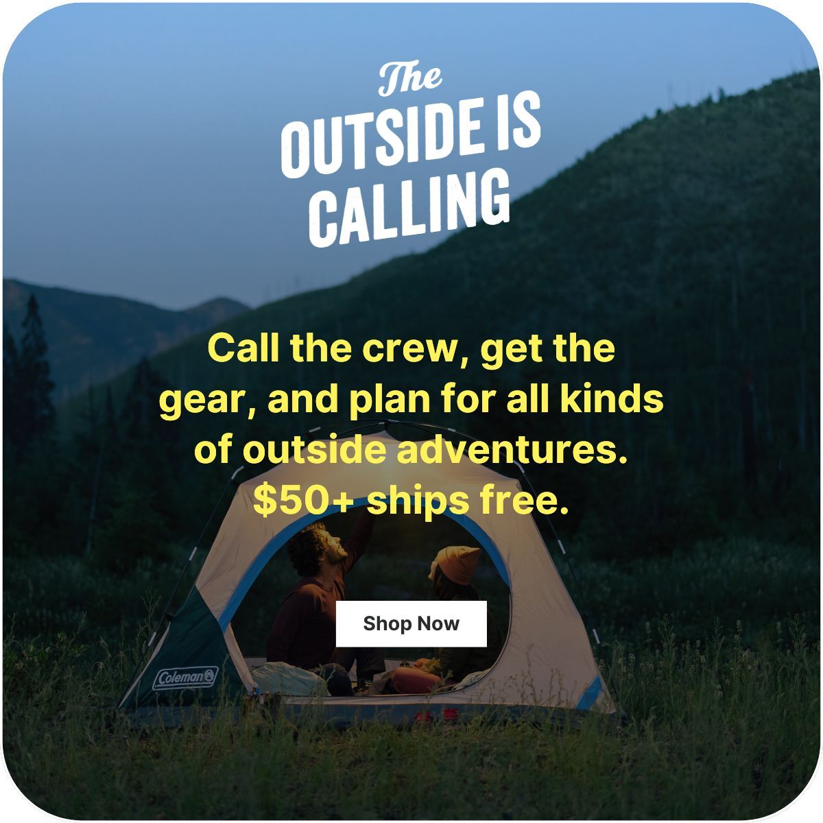 Two people are in a tent with the door open looking up at the night sky.