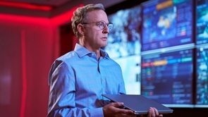 a male system administrator watching usage metrics